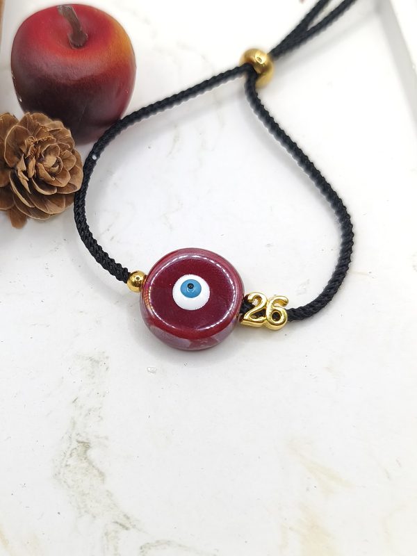 Βραχιόλι γούρι με κεραμικό μάτι μπορντό