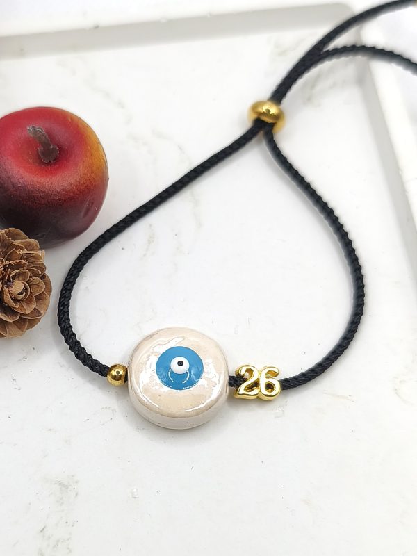 Βραχιόλι γούρι με κεραμικό μάτι μπεζ